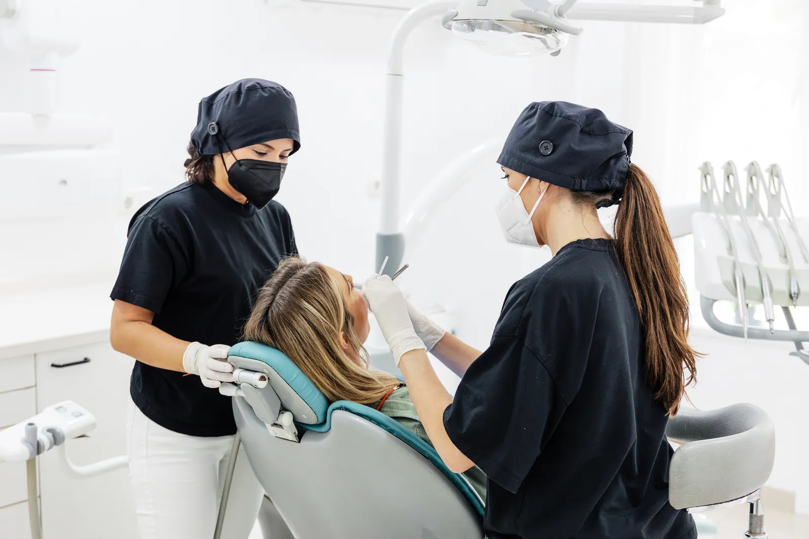Two Fons Badal clinicians treating a patient